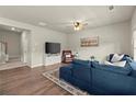 Comfortable living room featuring hardwood floors, stylish furniture, and staircase at 2110 Prichard Park Dr, Kennesaw, GA 30144
