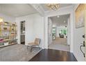 Bright and airy living space showcasing neutral walls, carpet, hardwood floors, a stylish bookshelf, and modern lighting at 312 Wichita Way, Mcdonough, GA 30253