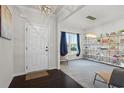 Inviting living room featuring neutral paint, stylish lighting, and a large window with lovely curtains at 312 Wichita Way, Mcdonough, GA 30253