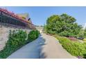 Winding driveway leading to an elegant home with lush landscaping at 5004 Gunnison Trce, Suwanee, GA 30024
