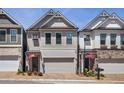 New townhome community with brick accents and a modern architectural design at 690 Stickley Oak Way, Woodstock, GA 30189