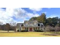 Lovely two-story home featuring a spacious front yard and classic architectural details at 200 Suffolk Way, Mcdonough, GA 30252