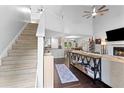 Bright living room featuring high ceilings, staircase, hardwood floors and natural light at 100 Karla Ct, Roswell, GA 30076