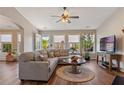 Bright and airy living room with wood floors, a comfortable sectional sofa, and lots of windows at 327 Stone Valley Xing, Canton, GA 30114