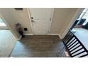 View of the entryway featuring wood-look flooring and white entry door at 808 Wade Farm Dr, Austell, GA 30168