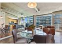Bright open-concept living area with sleek concrete floors, modern decor, and floor-to-ceiling windows at 923 Peachtree Ne St # 1625, Atlanta, GA 30309
