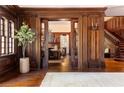 Elegant foyer with hardwood floors and detailed woodwork, offering a view into the living room at 1585 S Ponce De Leon Ne Ave # 20, Atlanta, GA 30307