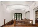 Bright hallway with gorgeous white trim, hardwood floors, and a stained glass window at 1585 S Ponce De Leon Ne Ave # 20, Atlanta, GA 30307