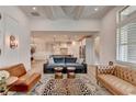 Bright living room featuring stylish decor, hardwood floors, and seamless flow to the kitchen at 3460 Montebello Pkwy, Cumming, GA 30028