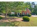 Beautiful brick home with manicured lawn and mature trees in a desirable neighborhood at 990 Lilac Arbor Rd, Dacula, GA 30019