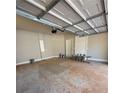 Spacious two car garage with overhead lighting perfect for car storage and additional workspace at 3089 Corbin Ave, Decatur, GA 30034
