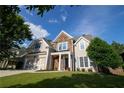 Beautiful two-story home with stone details, a well-kept lawn, and a convenient two-car garage at 36 Evergreen Way, Dallas, GA 30157