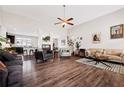 Open-concept living room boasts hardwood floors, high ceilings, and a seamless flow into the kitchen at 1129 Abundance Dr, Locust Grove, GA 30248
