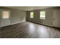 Spacious room featuring attractive floors, and multiple windows providing natural light at 820 Emerald Forest Cir, Lawrenceville, GA 30044