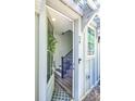 Inviting entryway with modern door, hardwood floors, and a staircase at 24 Becker Nw Pl, Atlanta, GA 30307