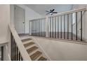 An open view of the upstairs hallway shows hardwood floors and black iron railing at 2531 Ridgecrest Nw Dr, Kennesaw, GA 30152