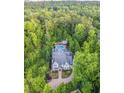 Expansive estate surrounded by lush greenery with a private backyard pool at 4140 Hillside Nw Pl, Atlanta, GA 30342