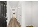 Inviting entryway with wood-look floors and neutral walls, leading to living spaces at 205 Kenoot Dr # 55, Mcdonough, GA 30253