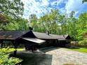Exterior view of the home and two-car garage with car port at 880 Havenridge Dr, Conyers, GA 30094