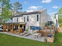 The back exterior is a perfect space for relaxation and entertainment, featuring a cozy patio area and a lush lawn at 2210 Spear Point Dr, Marietta, GA 30062