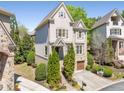 Beautiful two-story house boasts a two-car garage, manicured lawn, and tasteful landscaping for curb appeal at 1954 Saxon Valley Ne Cir, Brookhaven, GA 30319