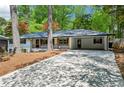 Attractive ranch home with an attached carport and a spacious driveway at 2301 Crestcliff Dr, Tucker, GA 30084