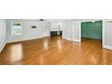 Open-concept living room boasting hardwood floors with modern gray paint at 2301 Crestcliff Dr, Tucker, GA 30084