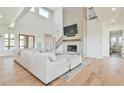 Inviting living room with a soaring ceiling, a floor-to-ceiling fireplace and ample natural light at 5315 Hendrix Rd, Cumming, GA 30040