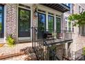 Inviting front porch with brick steps and black railing at 57 Weston Dr # 13, Atlanta, GA 30328
