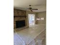 Living room view showing the brick fireplace and hardwood flooring at 4589 Mesaview Way, Stone Mountain, GA 30083
