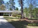 Inviting exterior view with lush greenery and charming front yard landscaping at 1170 Blair Bridge Rd, Austell, GA 30168