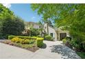 Beautifully landscaped home featuring a manicured lawn and inviting circular driveway at 20 S Prado Ne, Atlanta, GA 30309