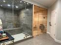 Modern bathroom with a glass-enclosed shower and sauna at 20 Rosemont Pkwy, Covington, GA 30016