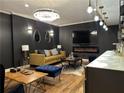 Sophisticated living room with modern lighting, sleek furniture, and fireplace at 20 Rosemont Pkwy, Covington, GA 30016