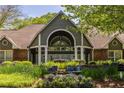 Beautifully landscaped clubhouse featuring a grand entrance with elegant architectural details and vibrant floral arrangements at 405 Mcgill Park Ne Ave, Atlanta, GA 30312