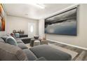 Cozy basement with plush seating, a large screen, and dim lighting perfect for movie nights at 4264 Windward Ln, Norcross, GA 30093