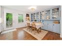 Charming dining room with built-in cabinets, hardwood floors, and natural light at 751 Upper Burris Rd, Canton, GA 30114