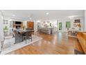 Open concept living area featuring hardwood floors and fireplace, flowing into the kitchen at 751 Upper Burris Rd, Canton, GA 30114