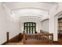 Hallway with detailed woodwork, staircase, and window with decorative glass panels at 1585 S Ponce De Leon Ne Ave # 19, Atlanta, GA 30307