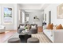 Open-concept living room featuring hardwood floors, stylish furnishings, and seamless flow into adjacent dining and kitchen areas at 1585 S Ponce De Leon Ne Ave # 19, Atlanta, GA 30307