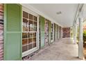 Inviting covered front porch with brick accents and view of the well-manicured yard. Windows galore! at 1725 Timberland Ne Rd, Atlanta, GA 30345