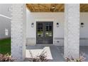 Inviting entrance with double doors and white-washed brick pillars at 1417 Coretta Scott Bnd, Atlanta, GA 30318