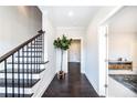 Bright foyer with dark hardwood floors and staircase at 1417 Coretta Scott Bnd, Atlanta, GA 30318
