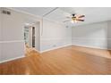 Spacious living room with hardwood floors and a classic ceiling fan at 3 Fairway Nw Dr, Kennesaw, GA 30144