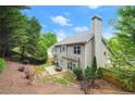 Backyard featuring a patio area and mature trees at 2995 Boulder Walk Se Ct, Atlanta, GA 30316