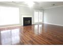 Bright living room with hardwood floors, fireplace, and access to the outdoor space at 3777 Harvest Dr, Decatur, GA 30034
