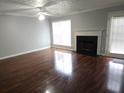 Living room with hardwood floors, fireplace, a window, and access to the outdoor space at 3777 Harvest Dr, Decatur, GA 30034
