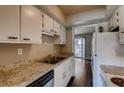 Functional kitchen with white cabinets, laminate countertops, and essential appliances at 6593 Sleepy Hollow Ln, Morrow, GA 30260
