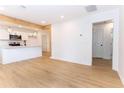 Bright and open-concept living space with hardwood floors and modern kitchen at 4215 Sherwood Ave, Decatur, GA 30035