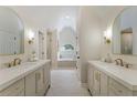 Primary bathroom with double vanity sinks, stand alone tub and walk-in shower at 1725 Redbud Way, Cumming, GA 30041